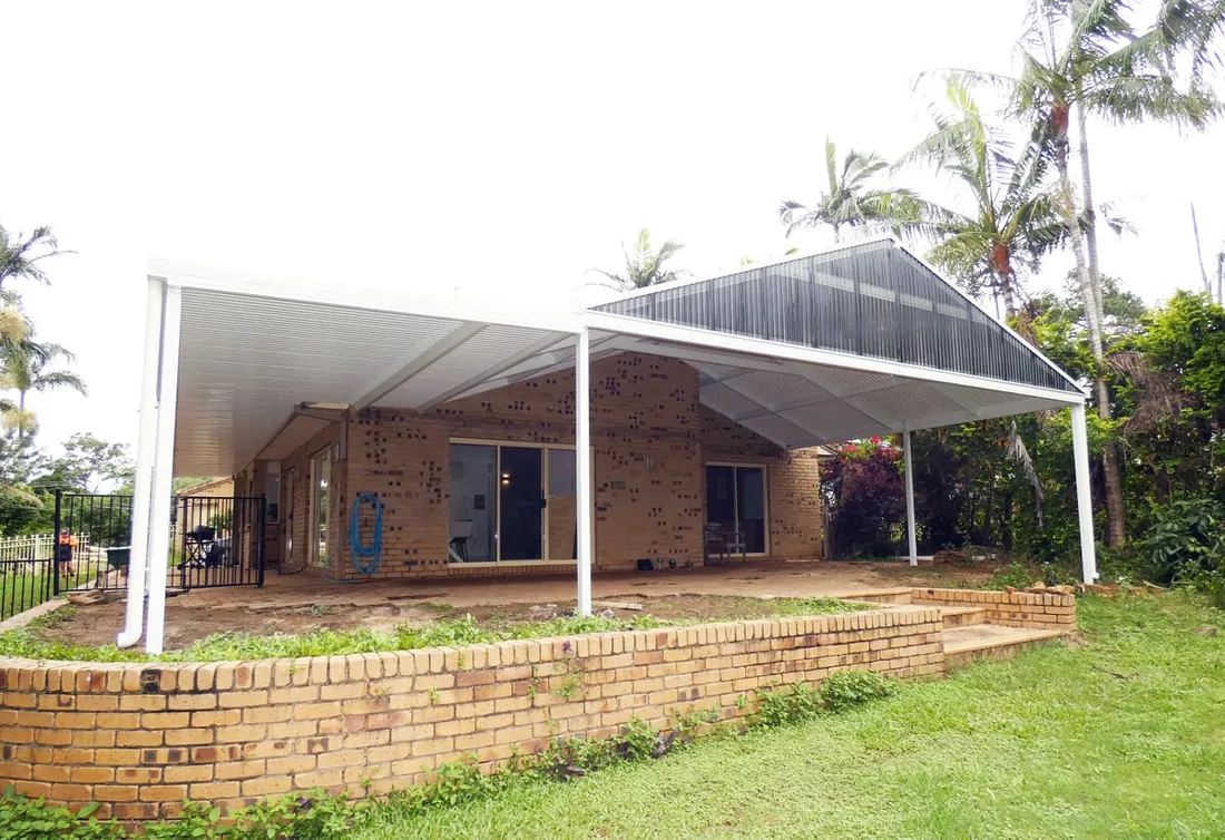 Gable-and-skillion patio wrapping a brick Queensland home