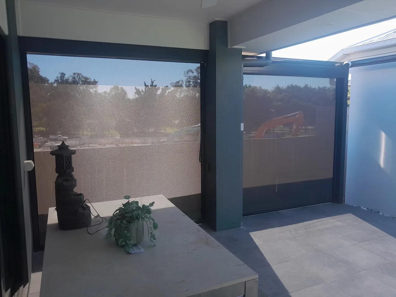 An outdoor area finished with blinds and awnings by Dam Good Patios