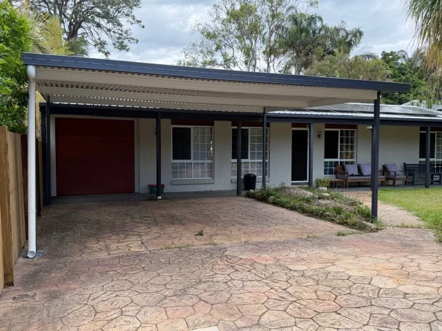Flat-roof carport added to the front of a Queensland home