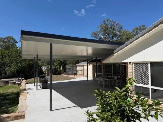 Completed skillion-roof patio wrapping a Queensland home, Dam Good Patios